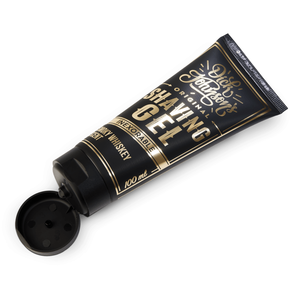 En tub Rakkräm - Excuse My French shaving gel av Dick Johnson på svart bakgrund.