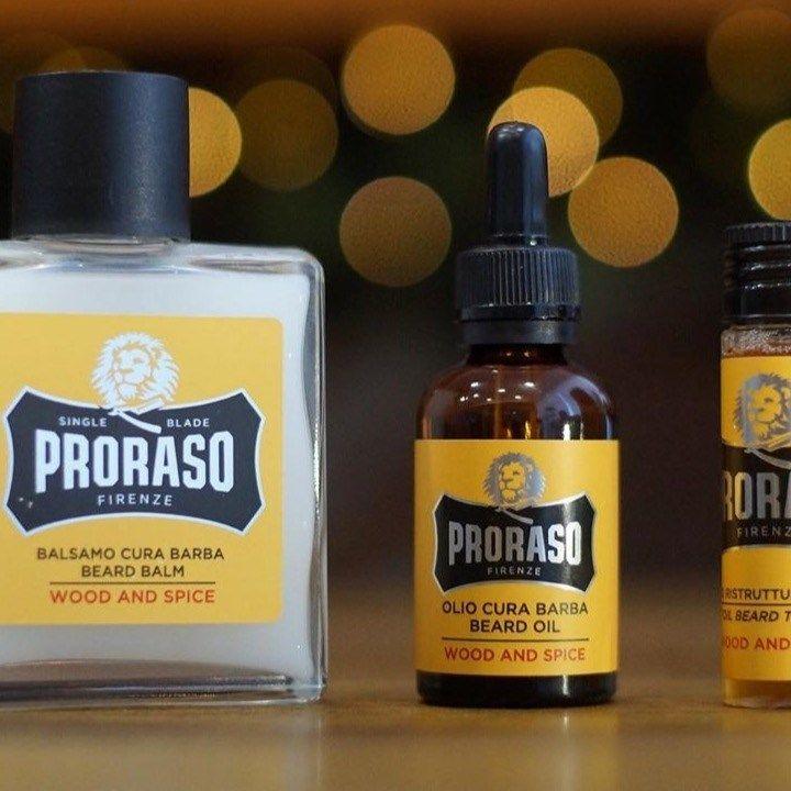 En flaska av Proraso Wood & Spice skäggolja och en burk skäggbalm.